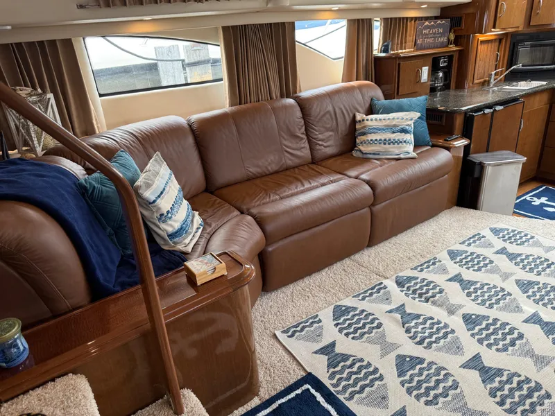 Slide: The Image of Luxurious interior of 2007 Carver 40 Motor Yacht with leather sofa and nautical decor. - 14