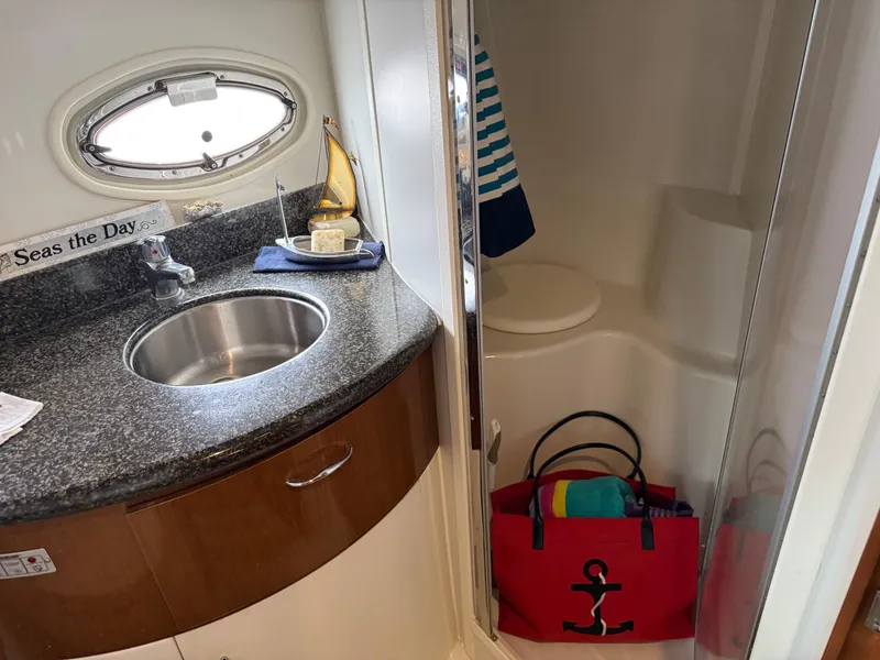 Slide: The Image of 2007 Carver 40 Motor Yacht bathroom with sink, shower, and nautical decor. - 17