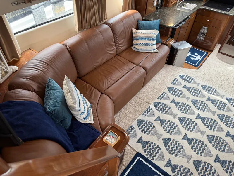Slide: The Image of Luxurious interior of 2007 Carver 40 Motor Yacht with leather sofa and nautical-themed decor. - 20