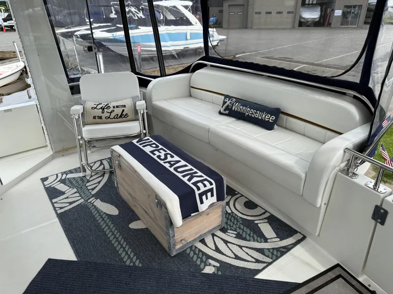 Slide: The Image of Luxurious 2007 Carver 40 Motor Yacht interior with lake-themed decor and comfortable seating. - 3