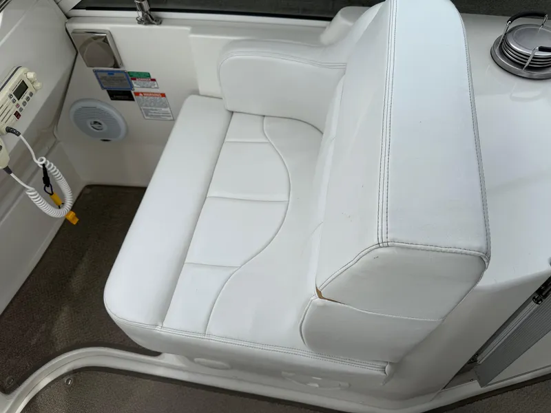 Slide: The Image of White leather seating on 2007 Carver 40 Motor Yacht, featuring control panel and speaker. - 5
