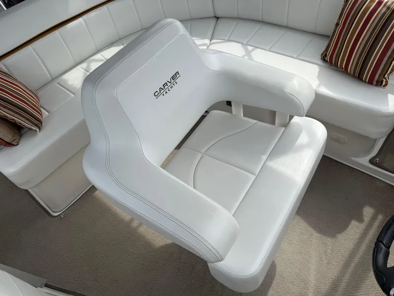 Slide: The Image of White leather seating on 2007 Carver 40 Motor Yacht with striped cushions. - 6
