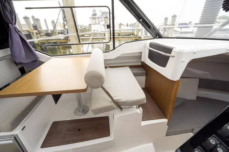 Slide: The Image of Interior of 2021 Jeanneau NC Weekender 795 Series 2, featuring seating and table. - 17