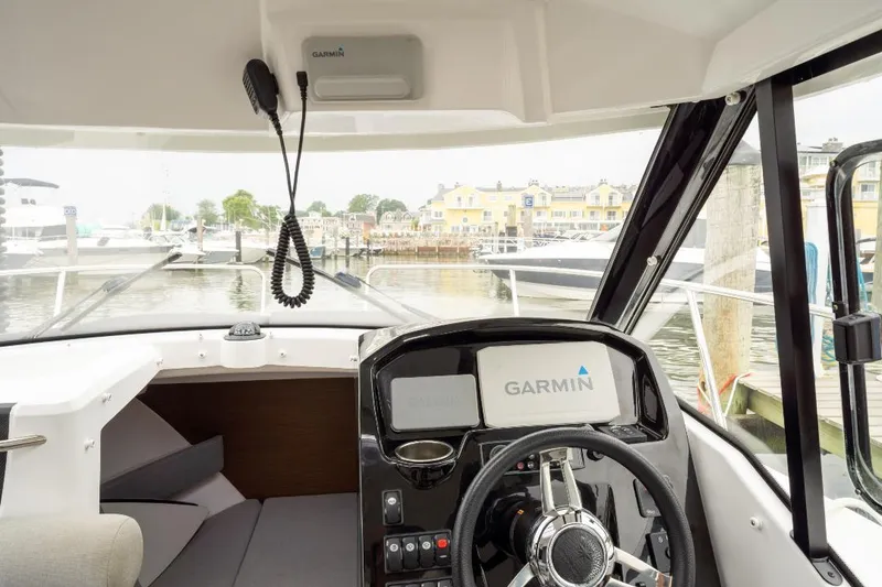 Slide: The Image of Interior view of 2021 Jeanneau NC Weekender 795 Series 2 boat with Garmin navigation system. - 24