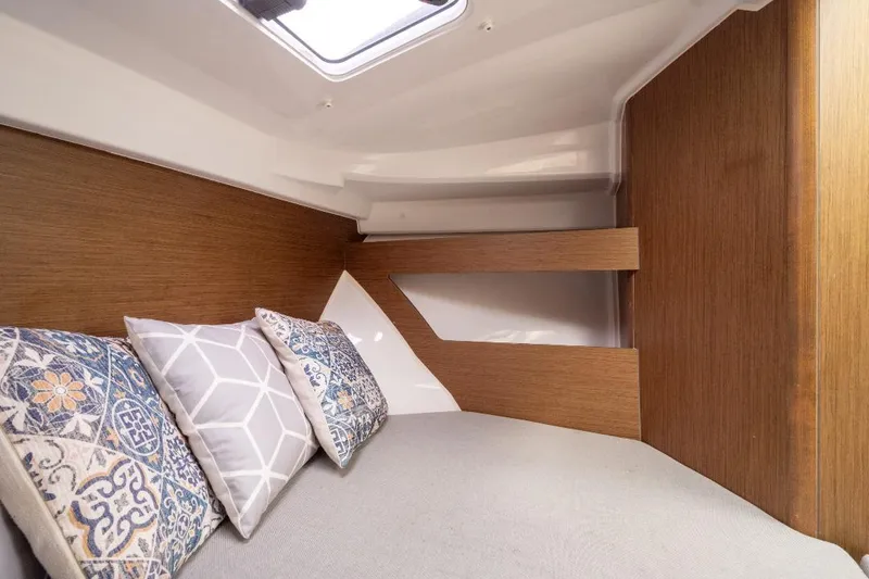 Slide: The Image of Interior cabin of 2021 Jeanneau NC Weekender 795 Series 2 with decorative pillows. - 29