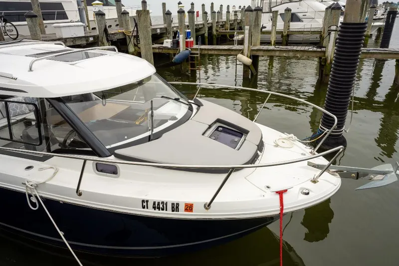 Slide: The Image of 2021 Jeanneau NC Weekender 795 Series 2 docked at marina, front view. - 3