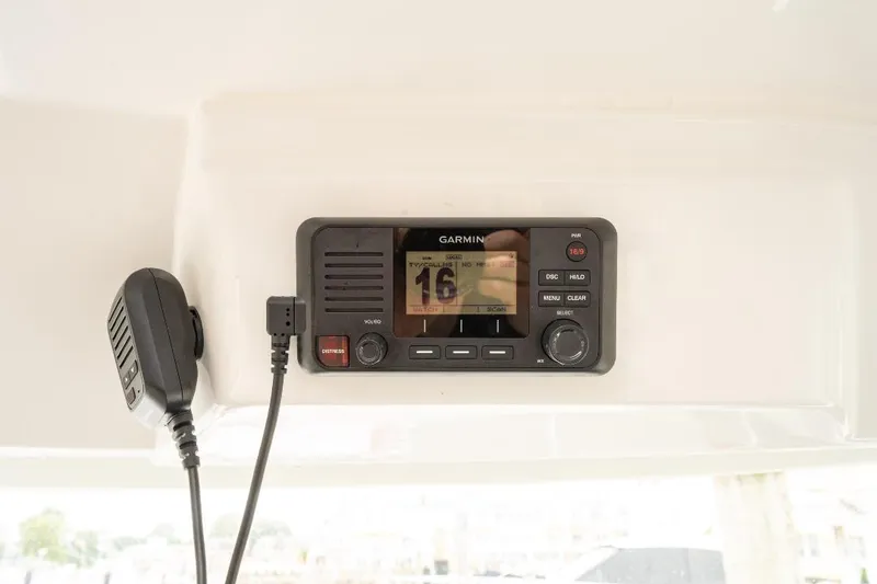 Slide: The Image of Garmin marine radio on 2021 Jeanneau NC Weekender 795 Series 2 boat dashboard. - 31