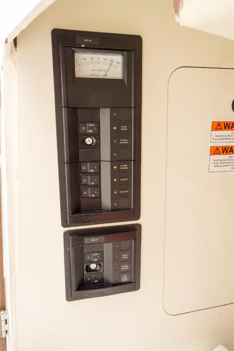 Slide: The Image of Electrical panel on a 2021 Jeanneau NC Weekender 795 Series 2 boat. - 32