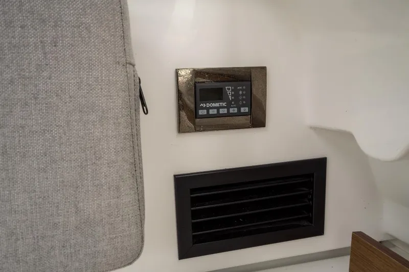 Slide: The Image of Control panel and vent inside 2021 Jeanneau NC Weekender 795 Series 2 boat. - 33