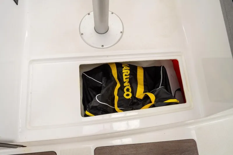 Slide: The Image of Storage compartment on Jeanneau NC Weekender 795 Series 2 boat, featuring a Marinco bag. - 39