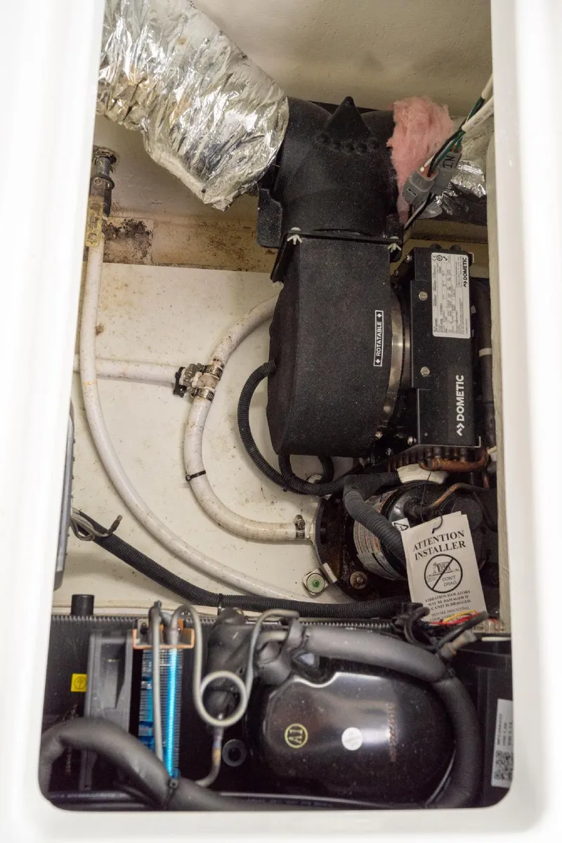 Slide: The Image of Engine compartment of 2021 Jeanneau NC Weekender 795 Series 2 boat, showing mechanical components. - 40