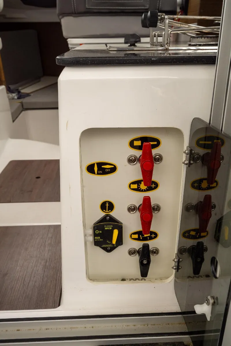 Slide: The Image of Control panel of 2021 Jeanneau NC Weekender 795 Series 2 boat with switches and labels. - 42