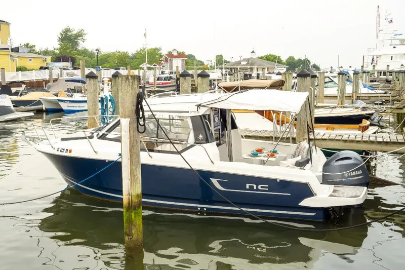 Slide: The Image of 2021 Jeanneau NC Weekender 795 Series 2 docked at marina with Yamaha engine. - 43