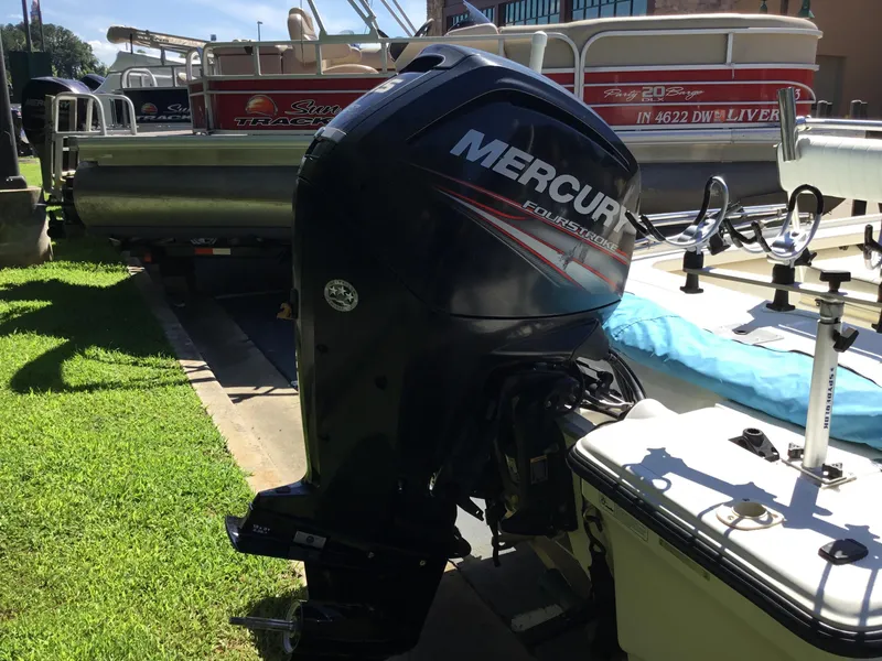 Slide: The Image of 2015 Mako 18 LTS boat with Mercury FourStroke outboard motor in a marina. - 10