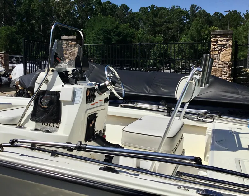 Slide: The Image of 2015 Mako 18 LTS boat interior with steering console and seating. - 7