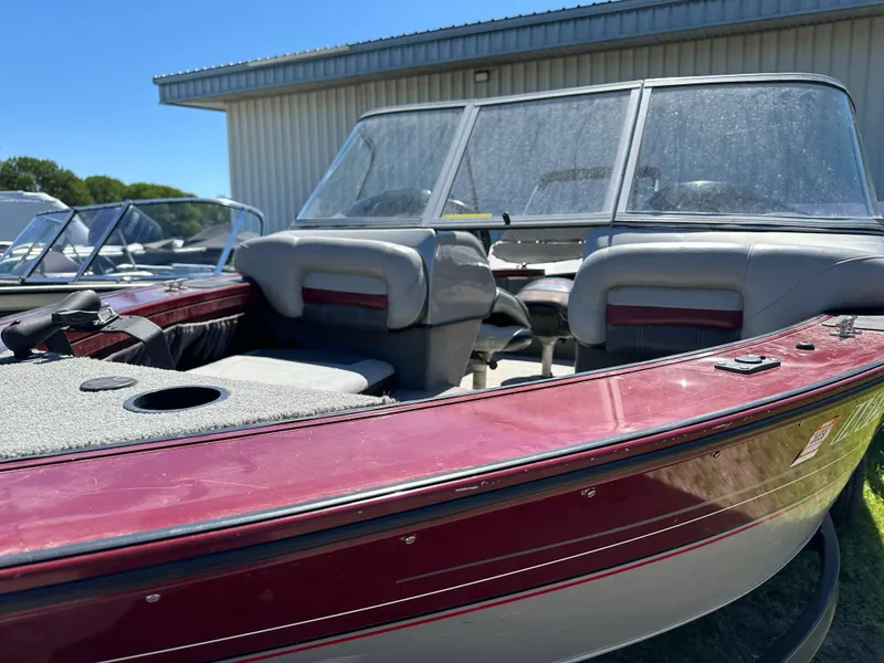 Slide: The Image of 2011 Tracker Targa V-18 Combo boat with maroon exterior and spacious seating. - 15