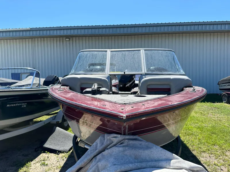 Slide: The Image of 2011 Tracker Targa V-18 Combo boat parked outdoors, front view. - 16