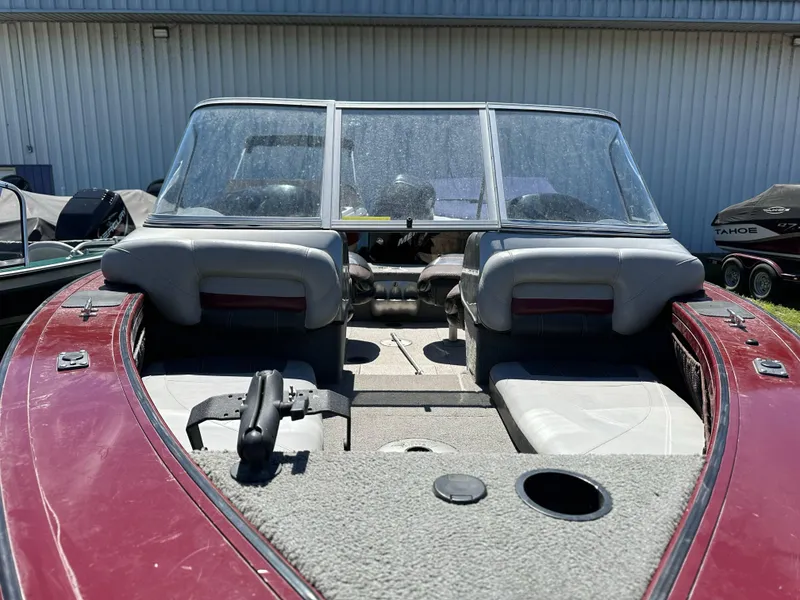 Slide: The Image of 2011 Tracker Targa V-18 Combo boat interior with red and gray seating. - 17