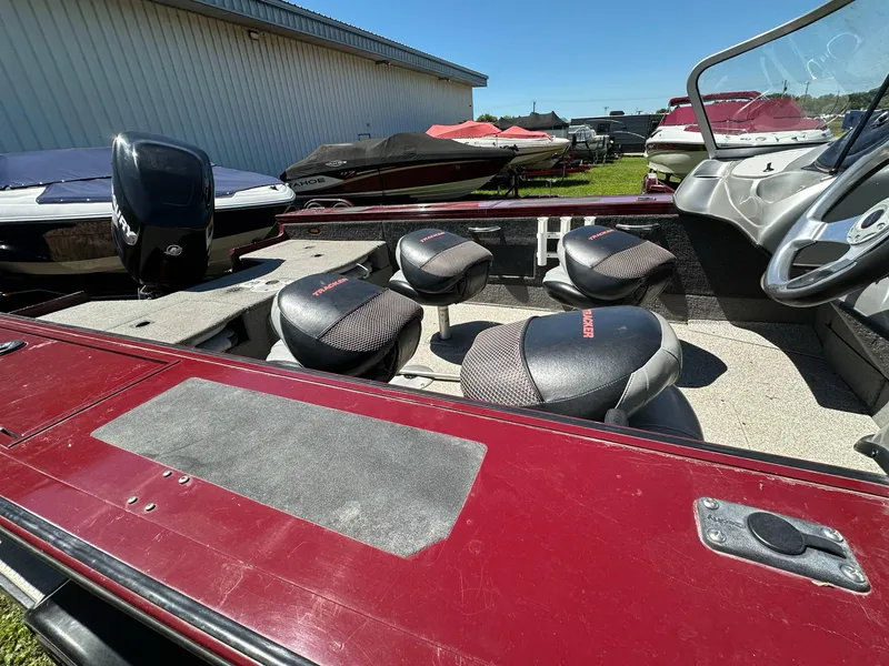Slide: The Image of 2011 Tracker Targa V-18 Combo boat interior with seating and steering wheel. - 20