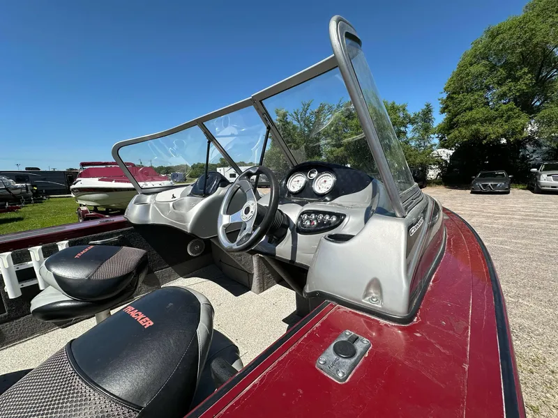 Slide: The Image of 2011 Tracker Targa V-18 Combo boat interior with steering wheel and dashboard gauges. - 21