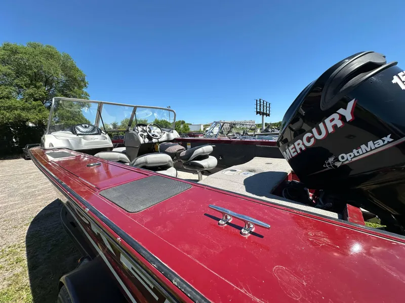 Slide: The Image of 2011 Tracker Targa V-18 Combo boat with Mercury OptiMax engine, parked outdoors. - 9