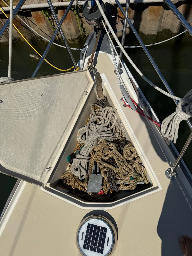 Slide: The Image of Anchor locker of 1982 O'Day 34 sailboat with ropes and solar light. - 11