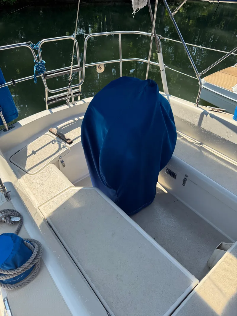 Slide: The Image of Cockpit of 1982 O'Day 34 sailboat with blue cover and ropes. - 12