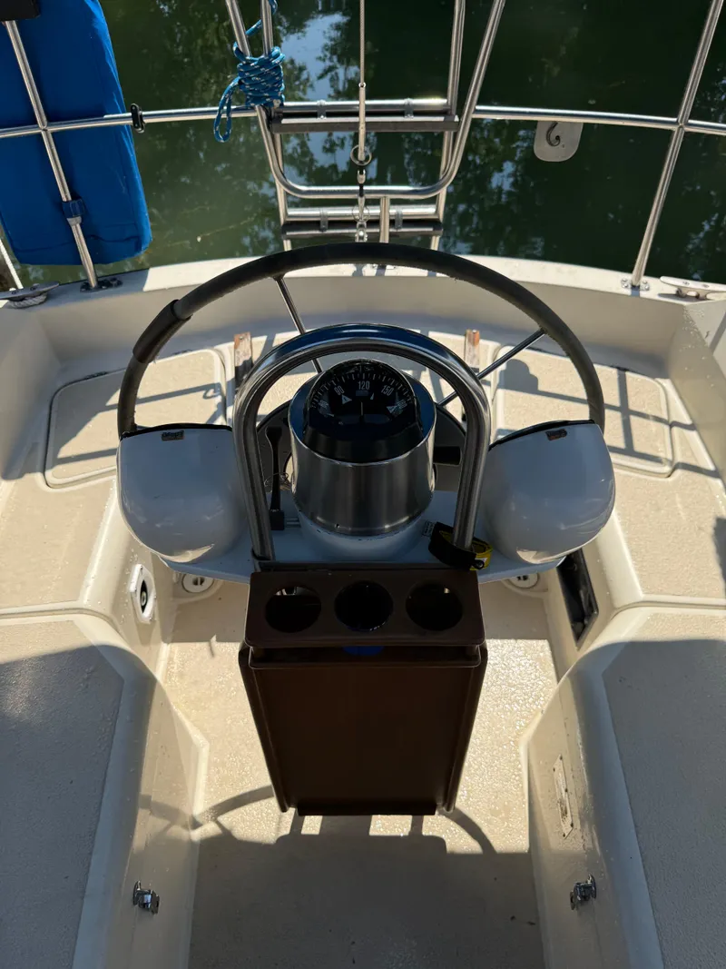 Slide: The Image of Steering wheel and compass on 1982 O'Day 34 sailboat cockpit. - 13