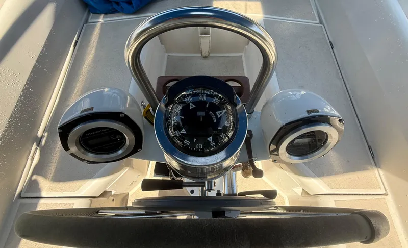 Slide: The Image of Steering wheel and compass on a 1982 O'Day 34 sailboat cockpit. - 15