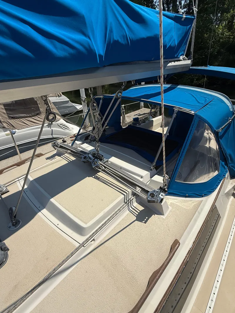 Slide: The Image of 1982 O'Day 34 sailboat deck with blue canvas covers and rigging. - 5