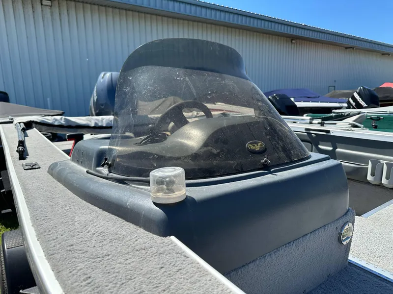 Slide: The Image of 2005 G3 1875 boat with windshield, parked outdoors under clear blue sky. - 20