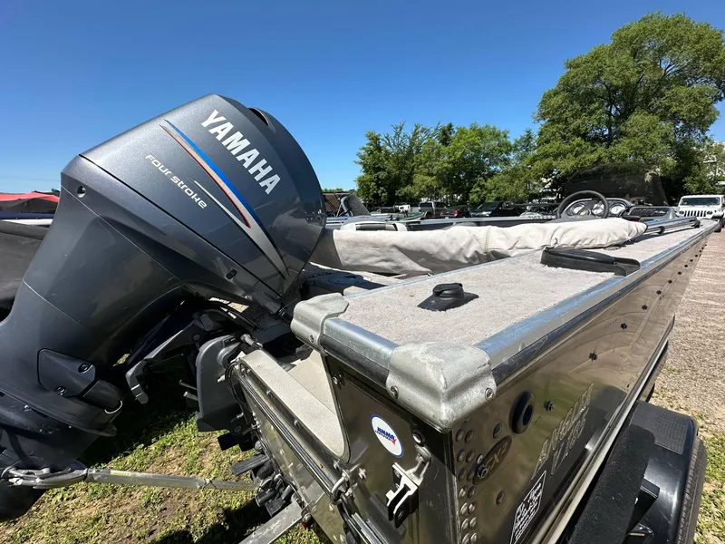 Slide: The Image of 2005 G3 1875 boat with Yamaha four-stroke engine, parked outdoors. - 6