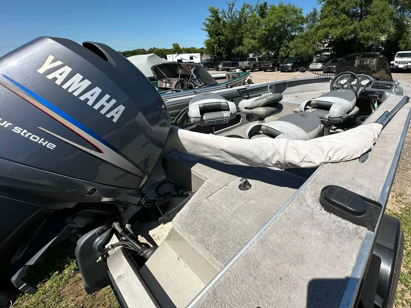 Slide: The Image of 2005 G3 1875 boat with Yamaha four-stroke engine, parked outdoors. - 7