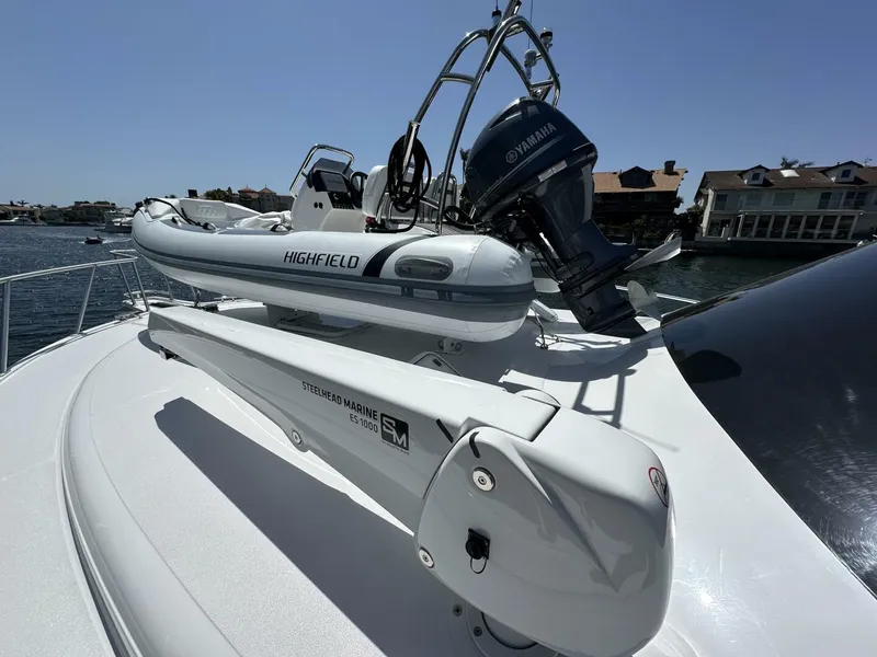 Slide: The Image of 2006 Cabo 48 Convertible yacht with Highfield tender and Yamaha motor on deck. - 28
