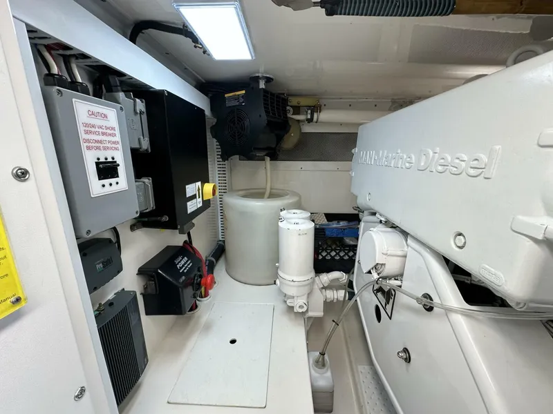 Slide: The Image of Engine room of 2006 Cabo 48 Convertible with MAN Marine Diesel engine components. - 40