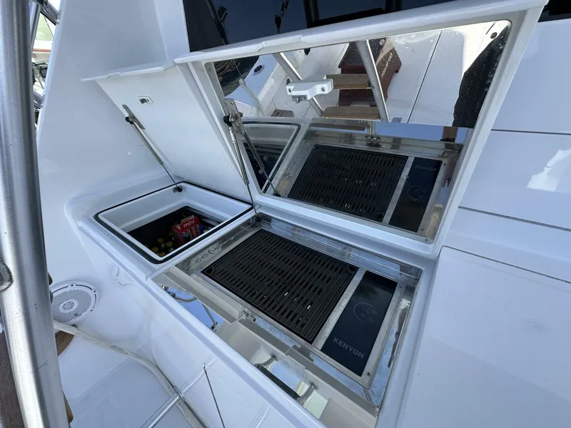 Slide: The Image of Outdoor grill and storage on a 2006 Cabo 48 Convertible yacht. - 45