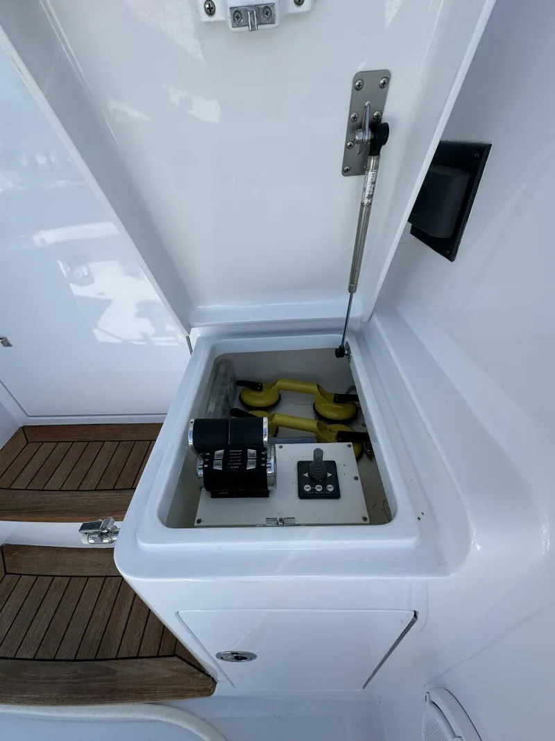 Slide: The Image of Open hatch on 2006 Cabo 48 Convertible boat, revealing mechanical components. - 47