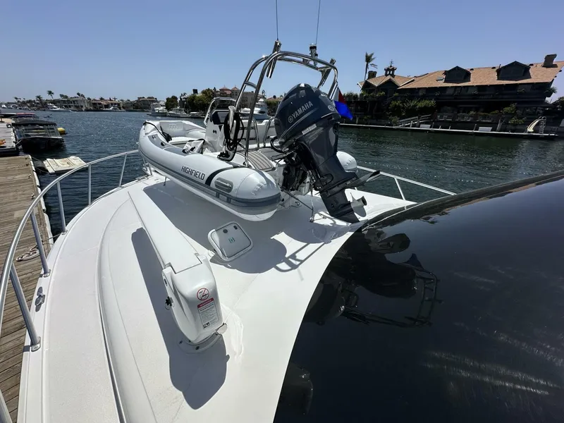 Slide: The Image of 2006 Cabo 48 Convertible yacht with inflatable boat and Yamaha motor on deck. - 6