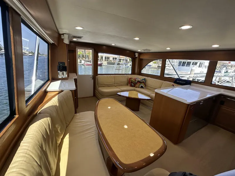 Slide: The Image of Luxurious interior of 2006 Cabo 48 Convertible yacht with spacious seating and waterfront views. - 7