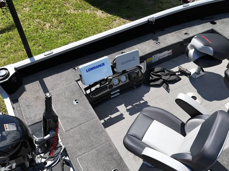 Slide: The Image of 2023 Alumacraft Competitor 185 Tiller boat interior with Lowrance and Garmin electronics. - 12