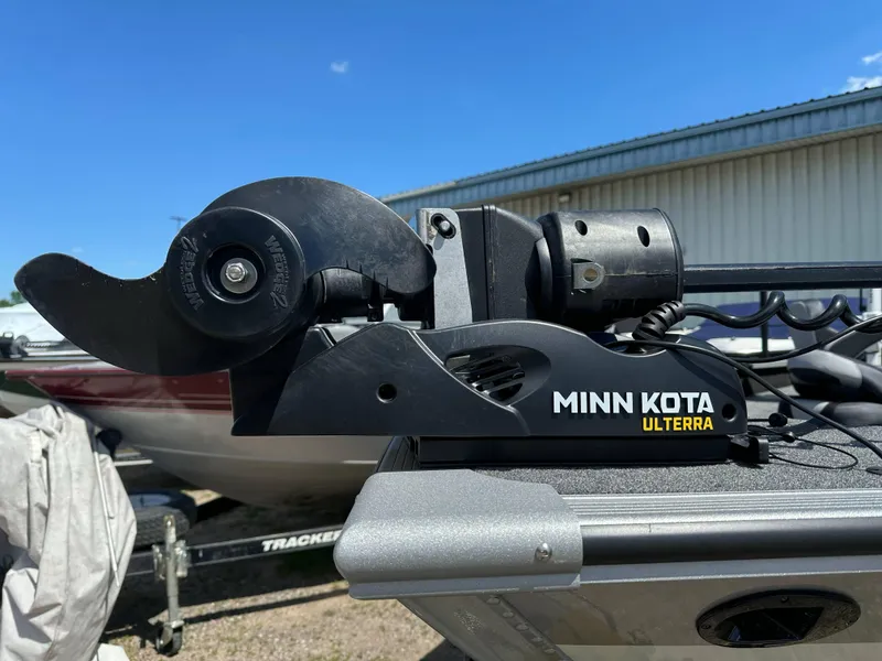 Slide: The Image of Minn Kota Ulterra motor on 2023 Alumacraft Competitor 185 Tiller boat, sunny day. - 14