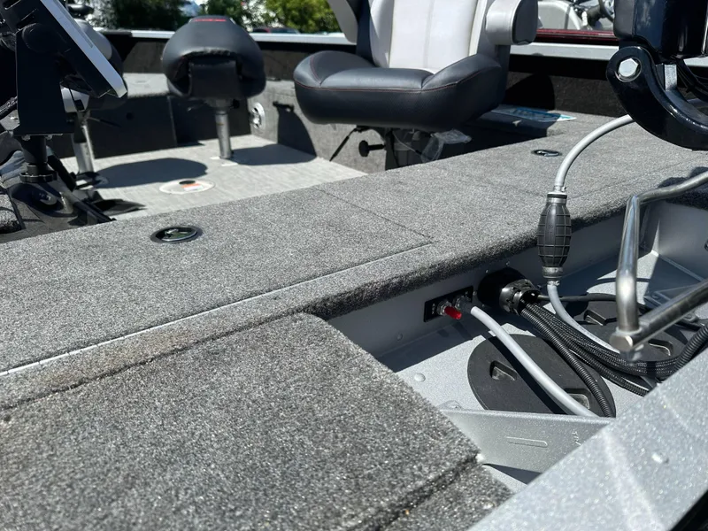 Slide: The Image of 2023 Alumacraft Competitor 185 Tiller interior with seating and control panel. - 23