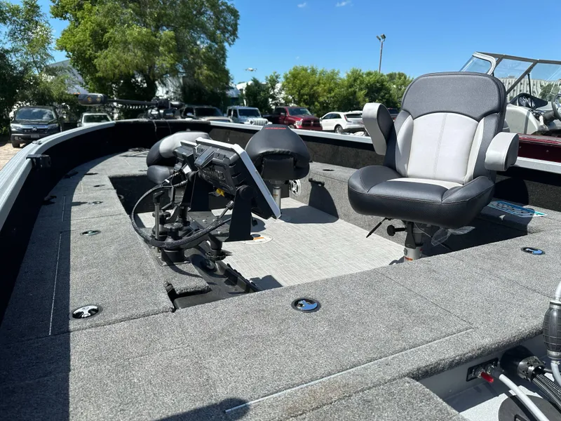 Slide: The Image of 2023 Alumacraft Competitor 185 Tiller boat interior with seating and control panel. - 24
