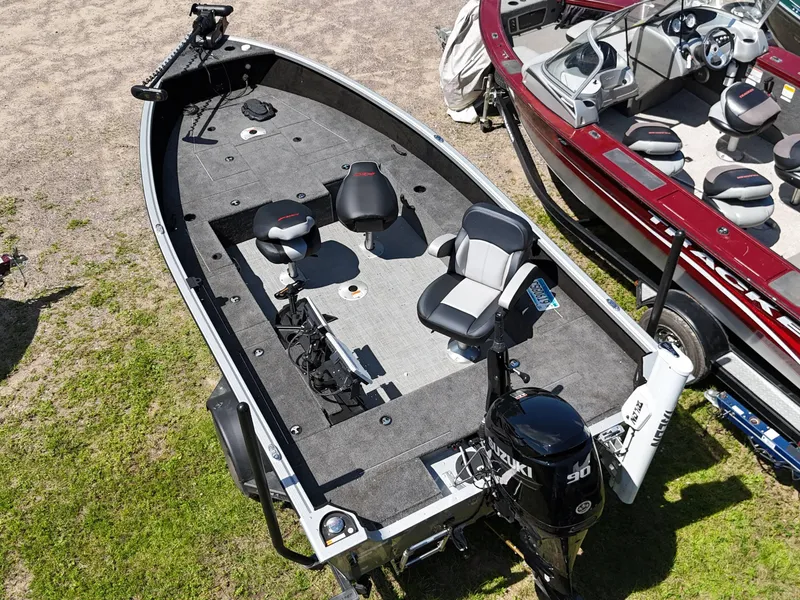 Slide: The Image of 2023 Alumacraft Competitor 185 Tiller fishing boat with spacious deck and modern seating. - 9