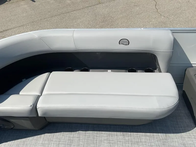 Slide: The Image of 2026 Sun Tracker PB 16 DLX boat seating with cup holders, featuring sleek gray upholstery. - 3