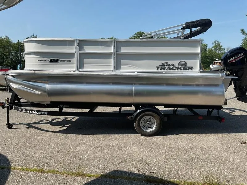 Slide: The Image of 2026 Sun Tracker PB 16 DLX pontoon boat on trailer, side view. - 6
