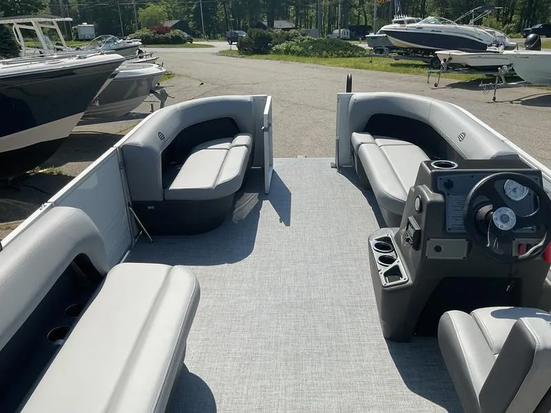 Slide: The Image of 2026 Sun Tracker PB 16 DLX pontoon boat with spacious seating and modern dashboard. - 8