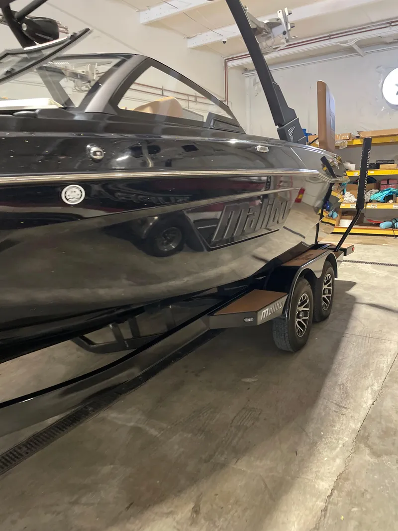 Slide: The Image of 2022 Malibu Wakesetter 23 LSV boat on trailer in indoor storage. - 10