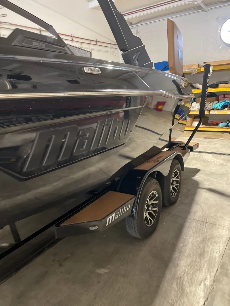 Slide: The Image of 2022 Malibu Wakesetter 23 LSV boat on trailer in storage facility. - 11