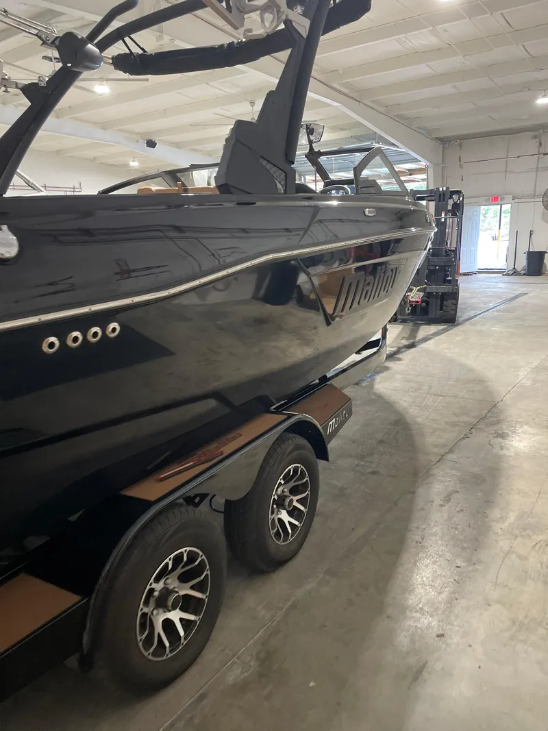 Slide: The Image of 2022 Malibu Wakesetter 23 LSV boat on trailer in indoor storage facility. - 7